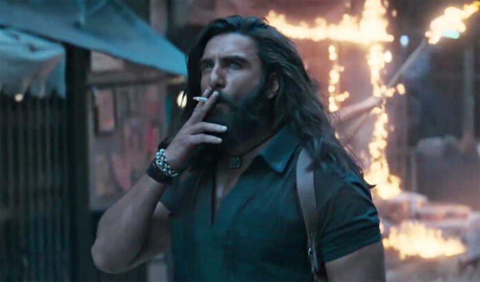 dhurandhar-2-trailer-ranvee Ranveer Singh in an intense action scene from the Dhurandhar 2 trailer featuring explosive background visuals