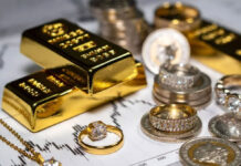 Gold Hits ₹1.44 Lakh, Silver Surges ₹12,000: Safe-Haven Rush Amid Global Tensions Drives Prices Higher Gold bars and silver coins stacked with rising price chart indicating surge in bullion rates