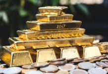 Gold Surges as West Asia Tensions Rise: Could Prices Hit $6,000? Silver Nears $100 Mark Gold bars and silver coins reflecting surge in precious metal prices amid West Asia tensions