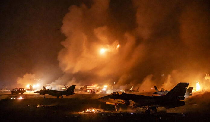 Missile and drone attack on Prince Sultan Air Base in Saudi Arabia with damaged aircraft and smoke