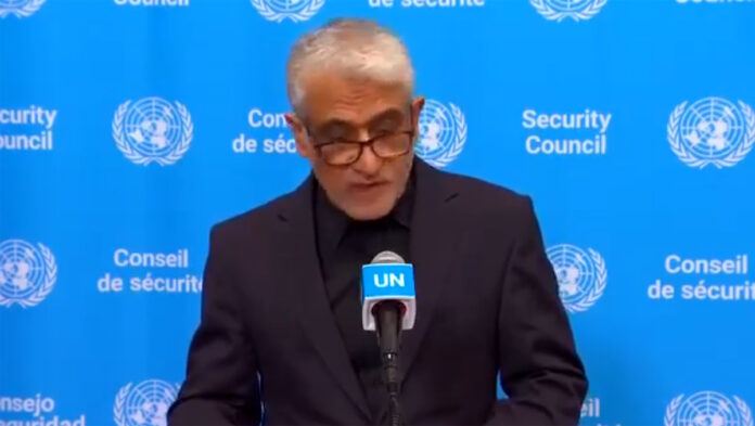 Iran's UN Ambassador Amir Saeid Iravani speaking at United Nations headquarters accusing US-Israel of civilian targeting in March 2026 conflict