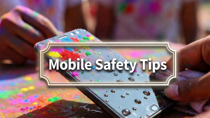 Smartphone covered in Holi colors and water with a person carefully cleaning it after Holi celebration.