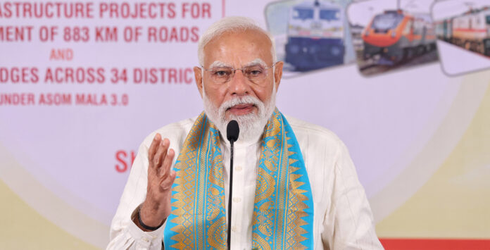 Prime Minister Narendra Modi addressing a public gathering during a development projects launch event in Guwahati, Assam.