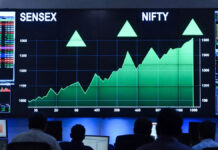 Sensex Jumps 568 Points, Nifty Tops 23,580 as Markets Extend Rally; Rupee Hits Record Low Sensex and Nifty surge on stock market screen with rising charts as rupee hits record low against US dollar