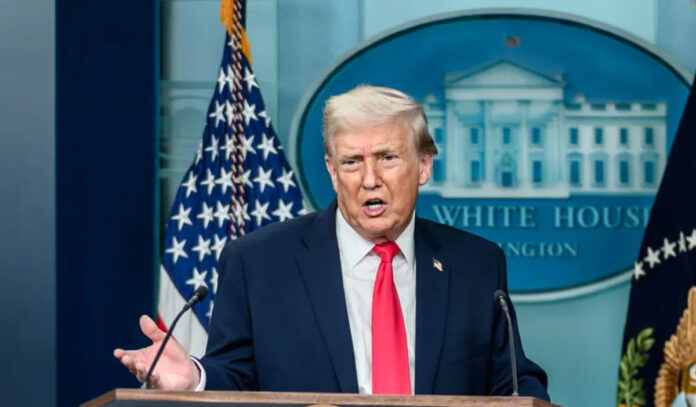 President Donald Trump delivering a video address on escalating Iran conflict