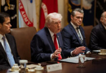 Trump Issues Sweeping Order to Tighten College Sports Rules, Targets Transfers and Player Payments Donald Trump signing executive order on college sports reforms with documents and US flag
