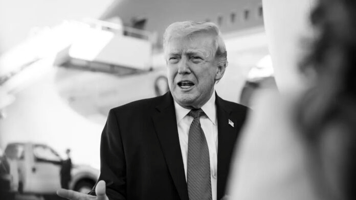 Donald Trump speaking amid Iran war tensions and MAGA backlash
