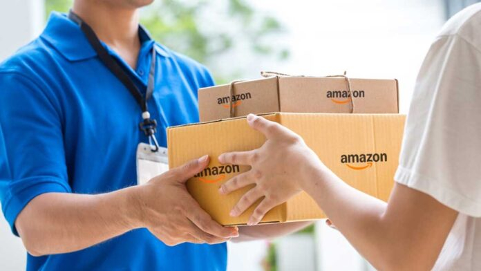 Amazon India warehouse with workers sorting packages using automated conveyor systems and AI logistics technology