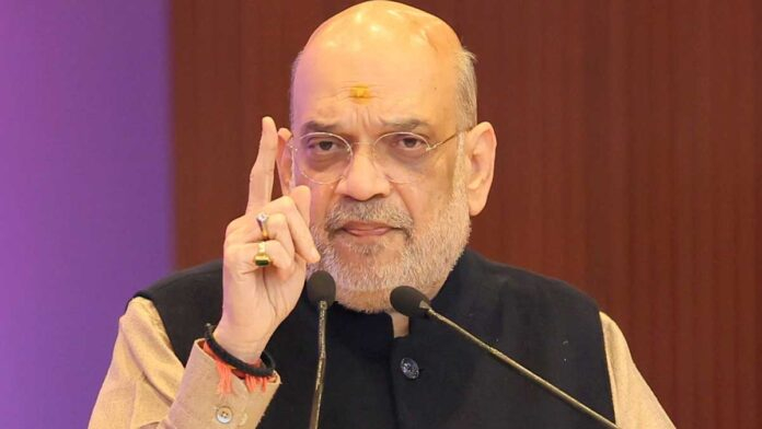 Amit Shah addressing a political rally in West Bengal with large crowd