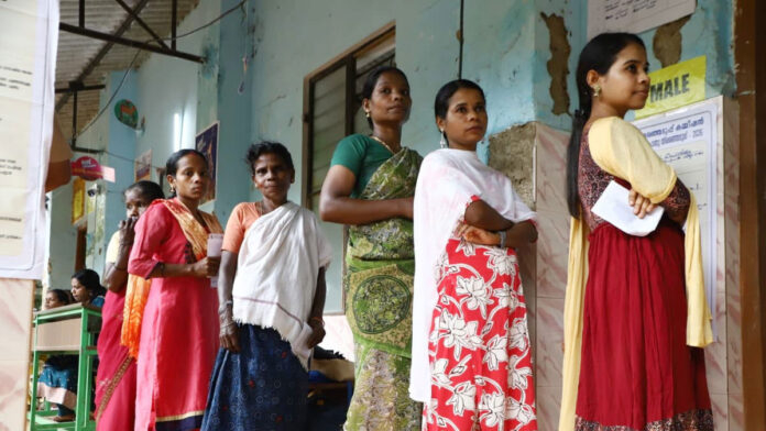 Voters standing in long queues during Assembly Elections 2026 in India
