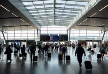 France Waives Transit Visa for Indian Flyers in Major Travel Boost from April 2026 Indian passengers walking through Paris airport transit terminal after France removes transit visa requirement