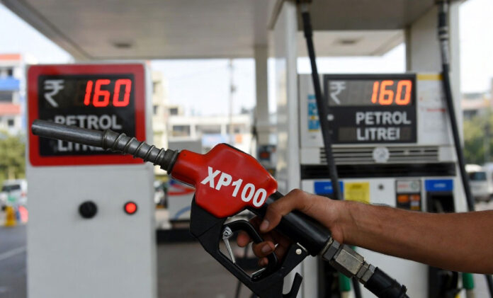 XP100 petrol price ₹160 per litre in Delhi with premium fuel pump and price board showing increase