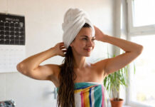 Hair Wash Astrology: Best & Worst Days Explained Woman washing hair in morning with natural light and calm environment