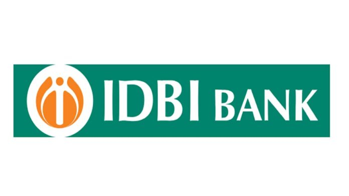 IDBI Bank branch exterior with financial charts showing Q4 FY26 results and profit decline