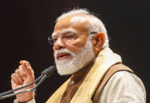 PM Modi Targets TMC in Bengal, Vows End to ‘Syndicate Raj’ PM Narendra Modi Bengal rally Purba Bardhaman speech BJP crowd