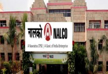 NALCO Q4 Results 2026: Profit Rises Sequentially to ₹1,718 Crore, Dividend Announced; YoY Dip Persists NALCO aluminium plant operations with industrial refinery and workers in safety gear