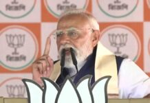 PM Modi Issues Strong Warning on Infiltration at Bengal Rally, Targets TMC Ahead of Poll Phase Prime Minister Narendra Modi addressing a large rally in Bongaon West Bengal during election campaign