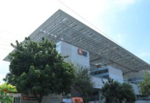REC Limited Q4 Results 2026: Profit Falls Sequentially, But FY26 Earnings Hit Record High; Shares Drop Nearly 5% REC Limited office building and power infrastructure financing concept in India