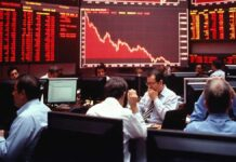 Stock Market Crash: Sensex Plunges Over 900 Points, Nifty Slips Below 24,000 Amid Oil Price Surge Sensex and Nifty crash with red market screen showing sharp decline amid oil price surge