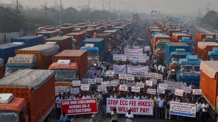 Truck drivers and transport unions protest in Delhi-NCR against ECC fee hikes and BS-4 vehicle restrictions during a three-day strike announcement.