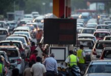 Fuel Prices Surge Again in India: Petrol Up 87 Paise, Diesel 91 Paise in Third Hike Within 10 Days Petrol pump worker filling fuel at an Indian gas station as petrol and diesel prices rise in major cities