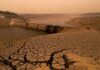 India Water Crisis Deepens: 13 Major Reservoirs Fall Below Half Capacity, Several Dams Run Dry Dry reservoir and cracked land highlighting India’s worsening water crisis in 2026