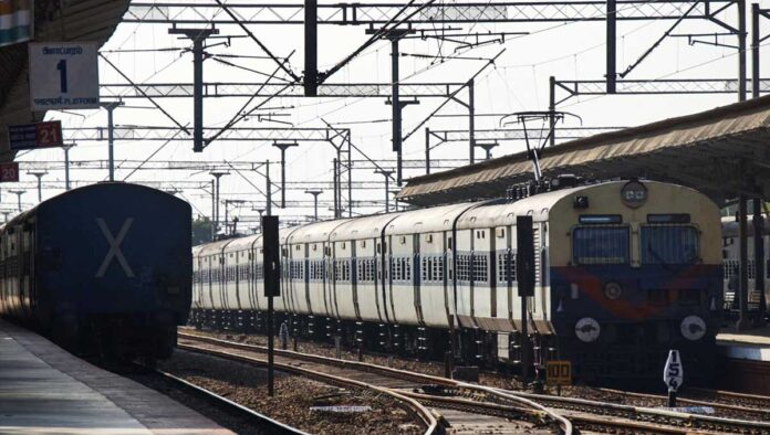 Indian Railways train arriving at Jhansi station after timing revision announcement