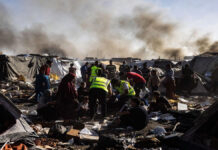 Israel Airstrike in Gaza: Woman and Child Killed in Strike on Displaced Families’ Camp Displaced Palestinian families inspect damage after an Israeli airstrike in southern Gaza