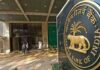 RBI May Announce Record-Breaking Dividend to Indian Government Amid Global Economic Uncertainty Reserve Bank of India headquarters building with financial charts representing record dividend transfer to the government