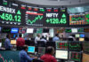 Sensex Opens Above 77,300, Nifty Tops 24,100 as Falling Crude Lifts Dalal Street Traders watch market screens as Sensex opens at 77,358 and Nifty at 24,126 during Thursday’s positive stock market opening in Mumbai.