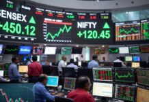 Sensex Opens Above 77,300, Nifty Tops 24,100 as Falling Crude Lifts Dalal Street Traders watch market screens as Sensex opens at 77,358 and Nifty at 24,126 during Thursday’s positive stock market opening in Mumbai.