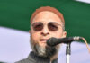 Owaisi Slams Bengal Welfare Eligibility Rule, Raises Concerns Over Voter List-Based Benefits AIMIM chief Asaduddin Owaisi addressing a press conference while discussing welfare benefits and voter list verification issues in West Bengal