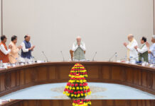 PM Modi 4399 Days Record Celebrated as NDA Leaders Applaud Historic Political Milestone Prime Minister Narendra Modi receives a standing ovation from NDA leaders during a meeting at Bharat Mandapam in New Delhi.