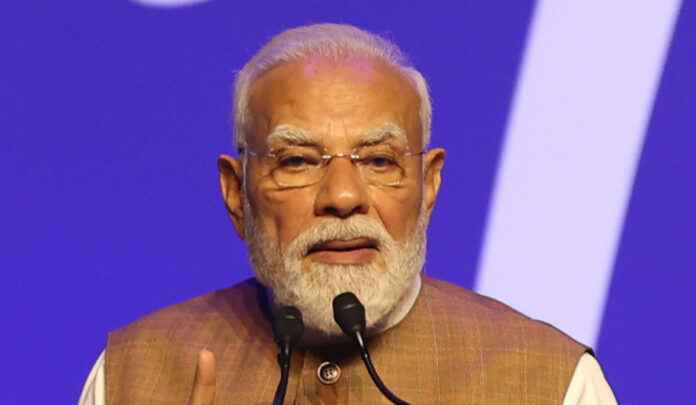pm-modi-pm-kisan-transfer-w Prime Minister Narendra Modi speaks at a public event in Tarakeswar after releasing PM-KISAN financial assistance to eligible farmers