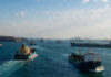 Iran Says Strait of Hormuz Will Remain Open but May Face New Transit Charges Amid Regional Tensions Cargo vessels navigating through the Strait of Hormuz as Iran discusses new operational rules for the strategic waterway.